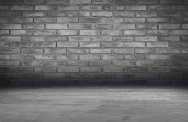 istock cement floor and brick wall backgrounds, dark room, interior. 1044044068