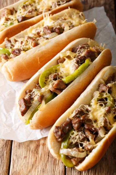 istock Delicious cheesesteak sandwiches close-up on the table. vertical 1044044844