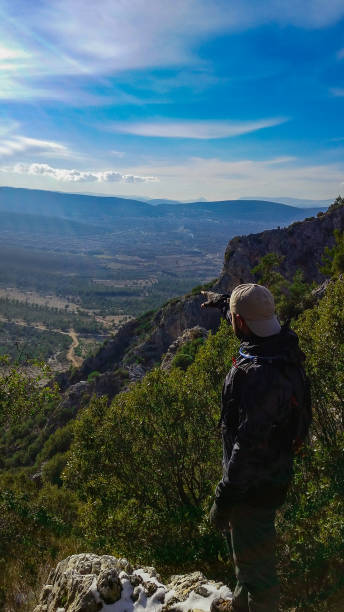 istock Man Standing on Top of the Mountain 1044062548