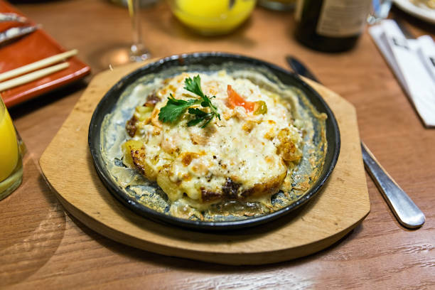 istock Baked salmon with potatoes and vegetables 1044066452