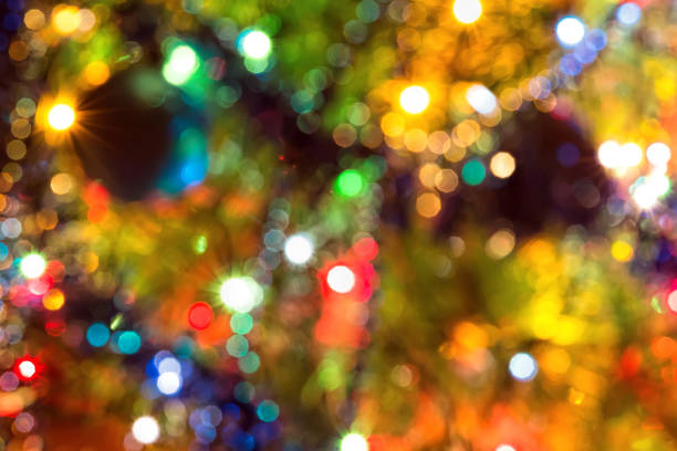 istock Abstract festive background with bokeh effect. Christmas tree and garlands of bright 1044068740