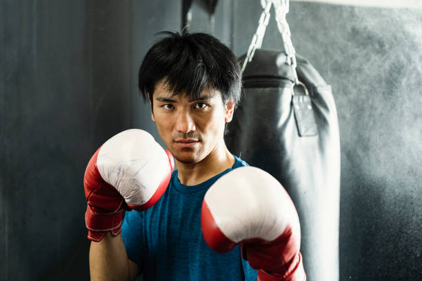 istock Mid adult boxer training at boxing gym 1044074884