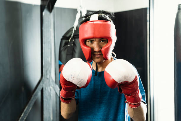 istock Mid adult boxer training at boxing gym 1044074886