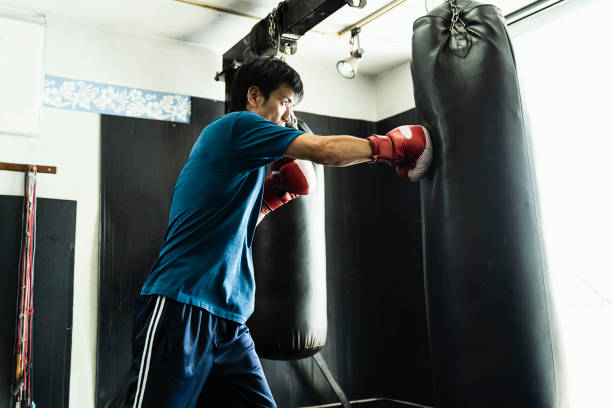 istock Mid adult boxer training at boxing gym 1044074918