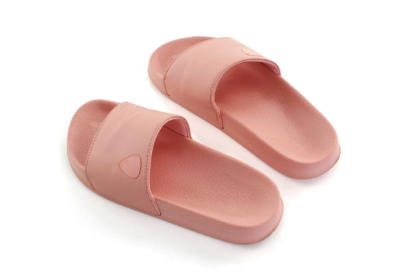 istock pink slippers isolated white background 1044078612