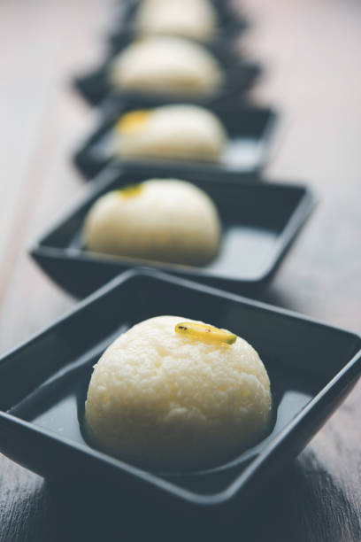Indian Rasgulla or Rosogulla dessert/sweet served in a bowl. selective focus