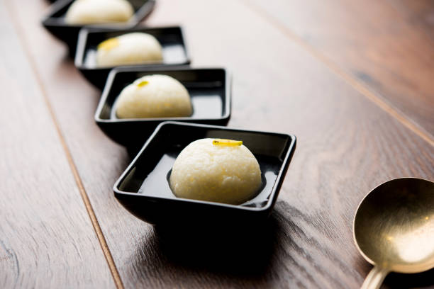 Indian Rasgulla or Rosogulla dessert/sweet served in a bowl. selective focus