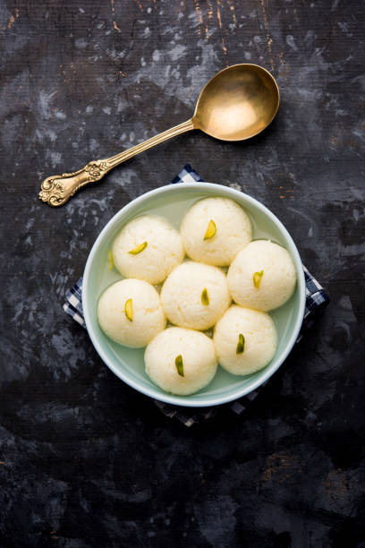 Indian Rasgulla or Rosogulla dessert/sweet served in a bowl. selective focus