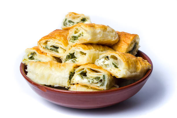 Homemade pie with cheese and spinach isolated Homemade pie with cheese and spinach isolated on white portion cut out cheese part of stock pictures, royalty-free photos & images