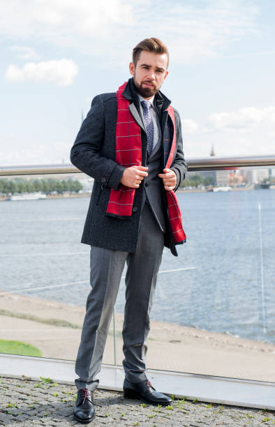 istock The man with a beard, poses in a business suit 1044084856