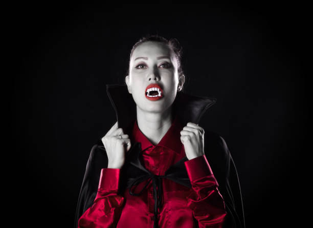 istock queen of vampires, black studio background 1044085524