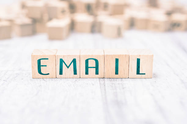 istock The Word Email Formed By Wooden Blocks On A White Table 1044087636
