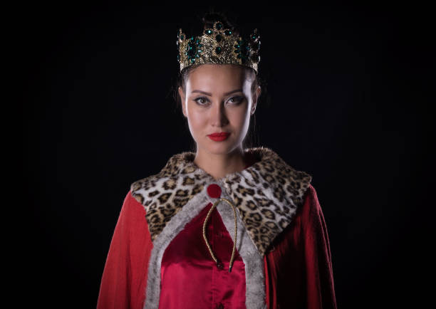 istock Princess with a crown, studio portrait on a black background 1044089786