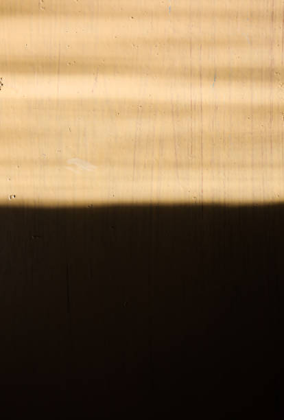 istock Beige painted background with sun lights on it. Whitewash texture. 1044095808