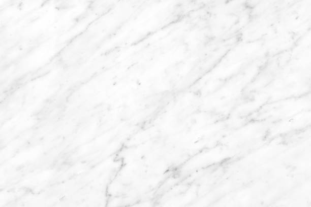 istock White Carrara Marble natural light surface for bathroom or kitchen countertop 1044100458