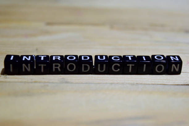 Introduction message written on wooden blocks. Introduction message written on wooden blocks. education and motivation concepts. Cross processed image on Wooden Background intro music photos stock pictures, royalty-free photos & images