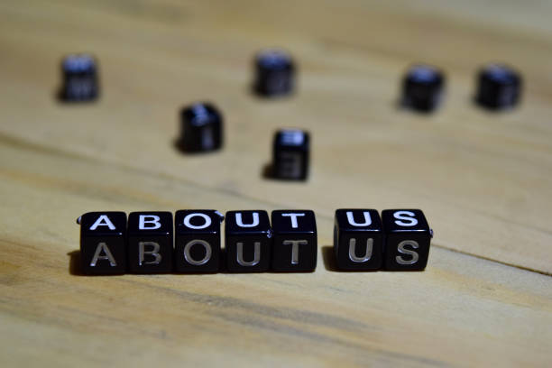 istock About us message written on wooden blocks. 1044101354