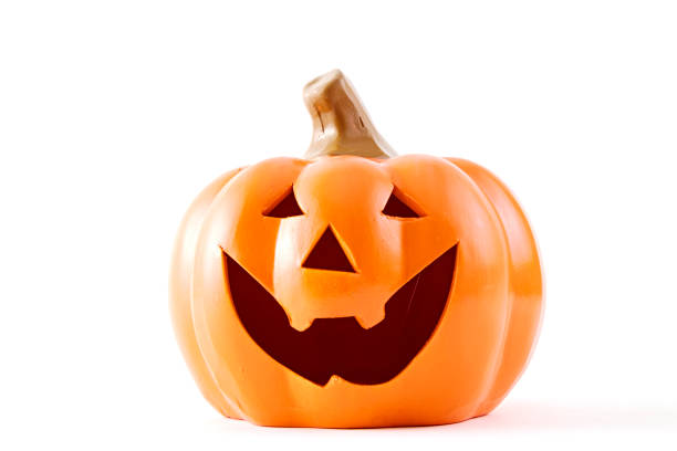 Halloween pumpkin cartoon has a happy face on a white background. There is an empty design theme, Light of the Moon, at midnight.