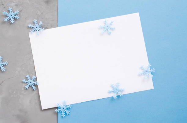 istock Christmas empty card with decorative snowflakes in blue color. 1044108626