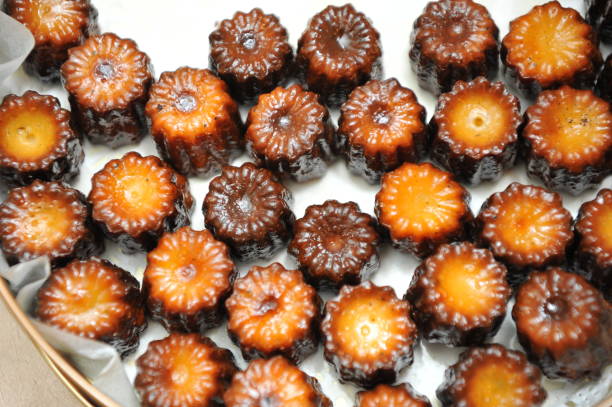 Colorful and delicious French dessert - Canelé stock photo