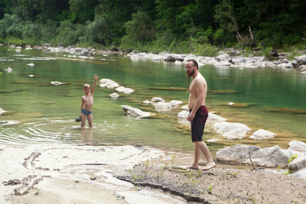 istock Father and son at the river 1044113046