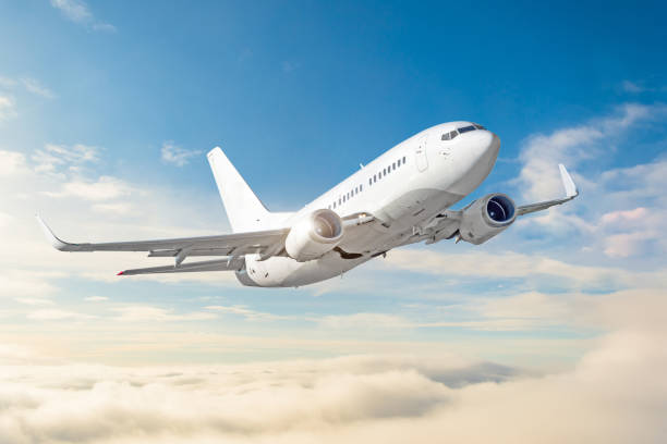 istock Passenger aircraft cloudscape with white airplane is flying in the daytime sky overcast. 1044113788