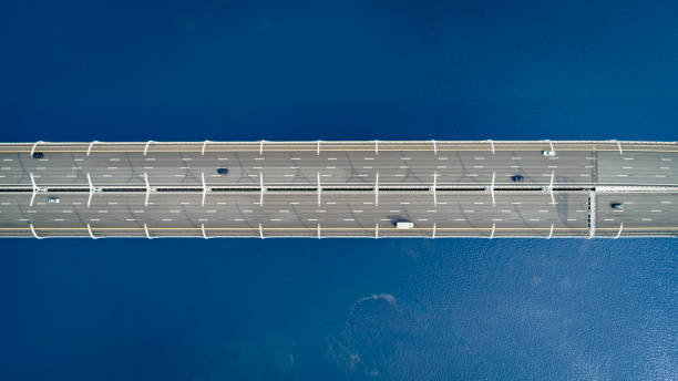 istock Aerial view of a high way over blue water 1044123242