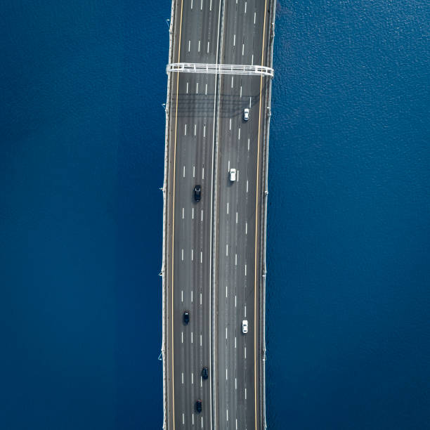 istock Aerial view of a high way over blue water 1044123264