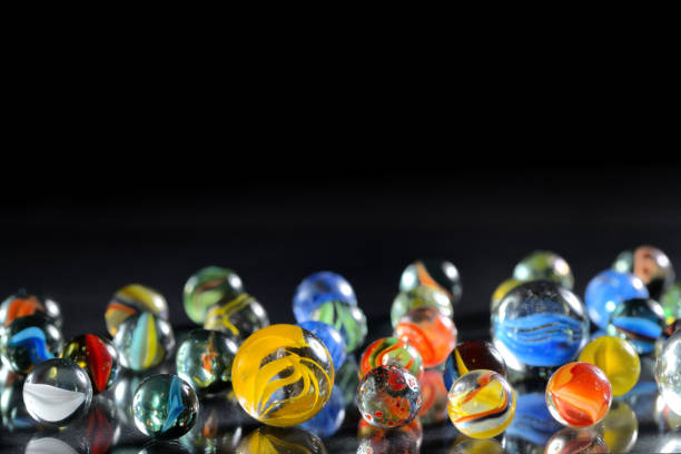 istock Different marble glass balls on black background 1044124014