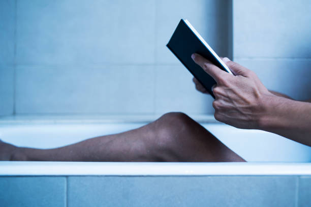 istock man reading in bathtub in a mysterious atmosphere 1044128160