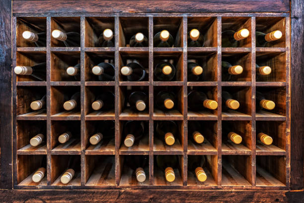 collection of bottles of wine on wooden cases - wine wine bottle box crate imagens e fotografias de stock