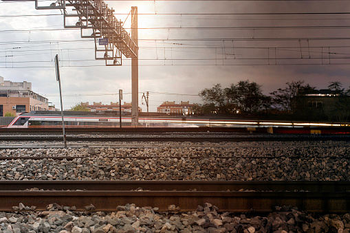photograph at three different times of the day of a train in Madrid