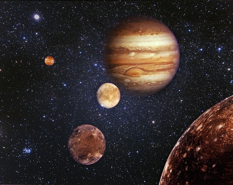 Planeta Júpiter y sus satélites en el espacio ultraterrestre photo