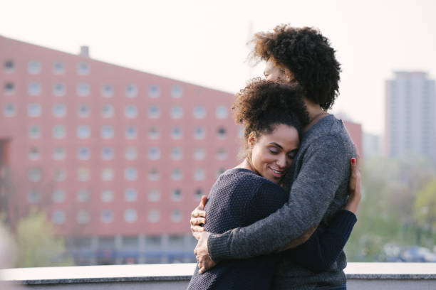 istock Young couple on a rooftop terrace at sunset 1044141850