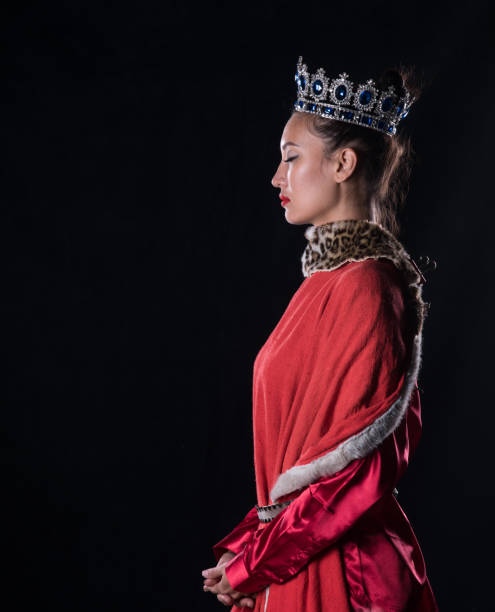 istock Princess with a crown, studio portrait on a black background 1044144714
