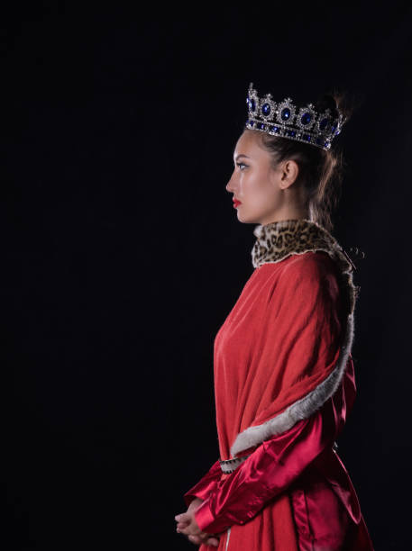istock Princess with a crown, studio portrait on a black background 1044144718