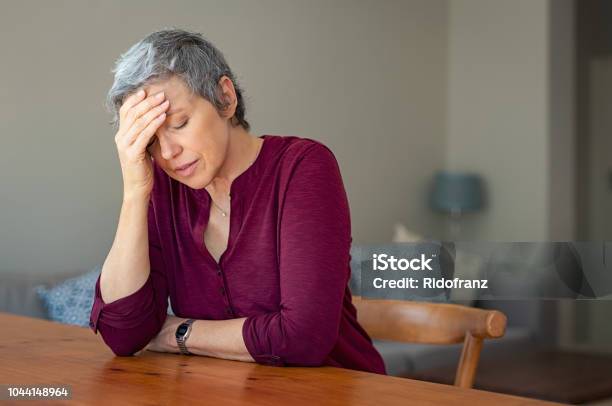 Stressed Senior Woman At Home Stock Photo - Download Image Now - Women, Emotional Stress, Mature Women