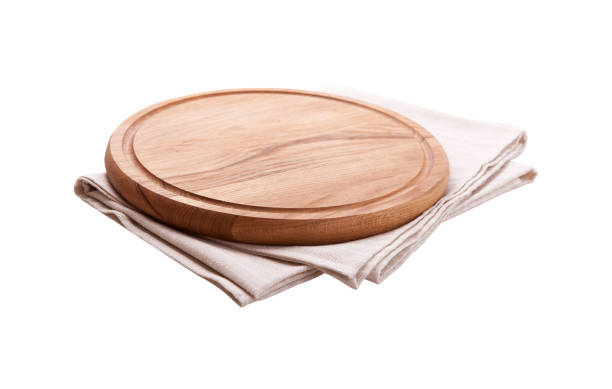 istock Napkin and board for pizza isolated on white. Canvas, dish towels on white background top view mock up. Selective focus. 1044149072