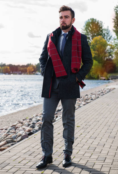 istock The man with a beard, poses in a business suit 1044150528