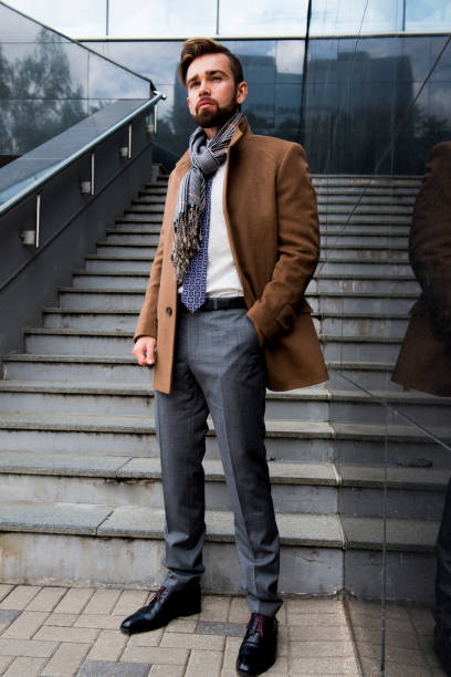 istock The man with a beard, poses in a business suit 1044150664
