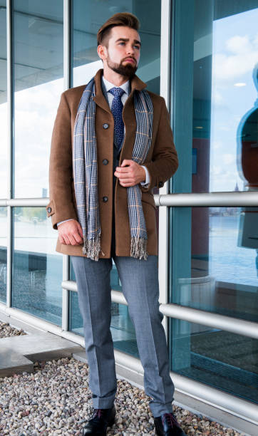 istock The man with a beard, poses in a business suit 1044150840