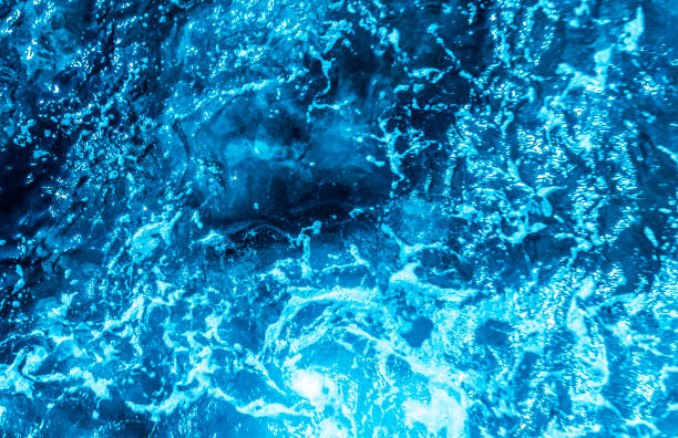 istock Blue sea foaming water background 1044153194
