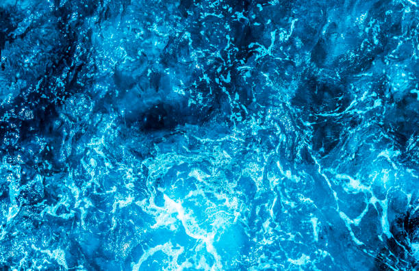 istock Blue sea foaming water background 1044153242