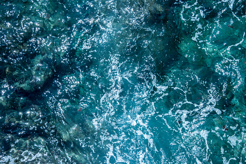 Blue sea foaming water background