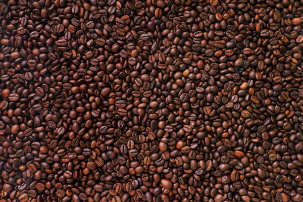 fondo marrón café. - coffee beans fotografías e imágenes de stock