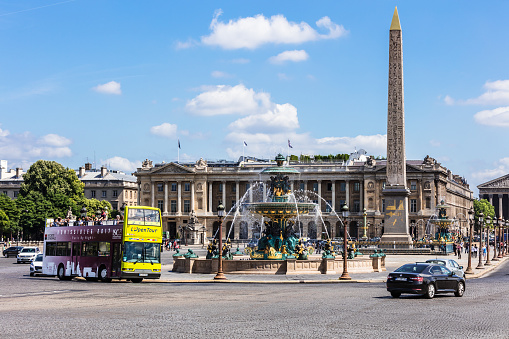 Paris, France - June 17, 2017: The Luxor Obelisk and the Fountain of River Commerce and Navigation at the center of the Place de la Concorde in Paris.