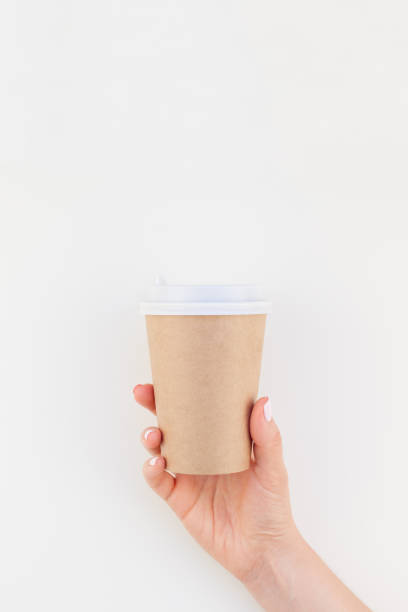 istock Mock up of coffee cup in female hand 1044165162