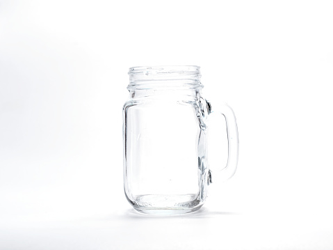 Empty mason jar for boiling water. White background