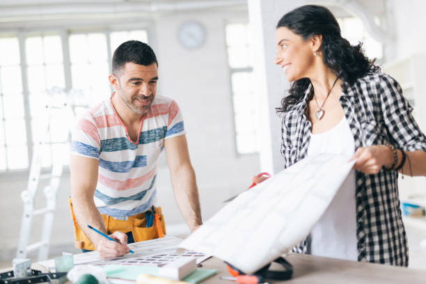 istock Couple decorating new home 1044166270