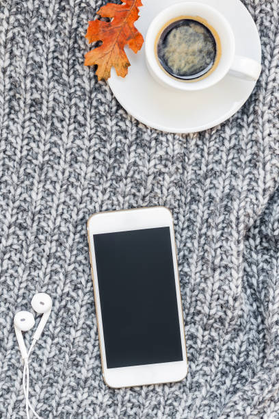 istock Home workplace with coffee cup on knitted plaid 1044168894